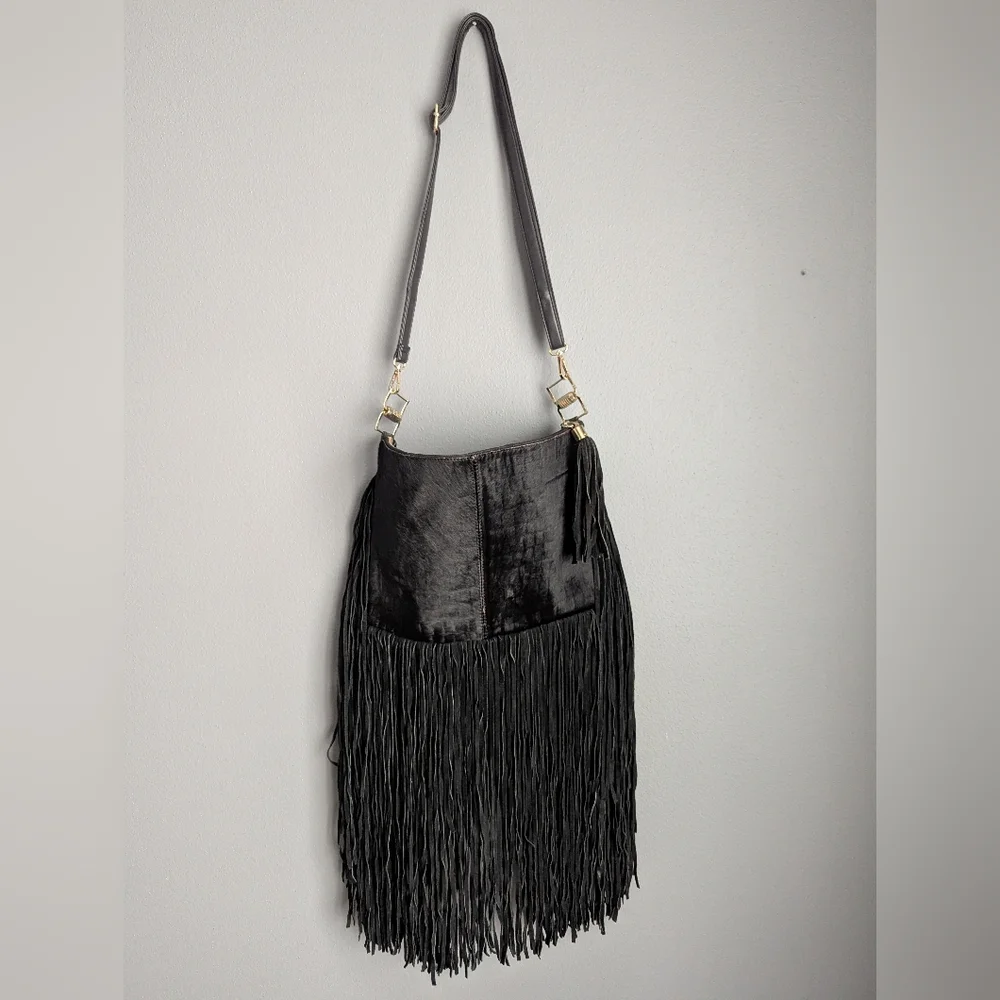 Black leather Fringe crossbody bag feels like cow leather. No tags. No brand tag